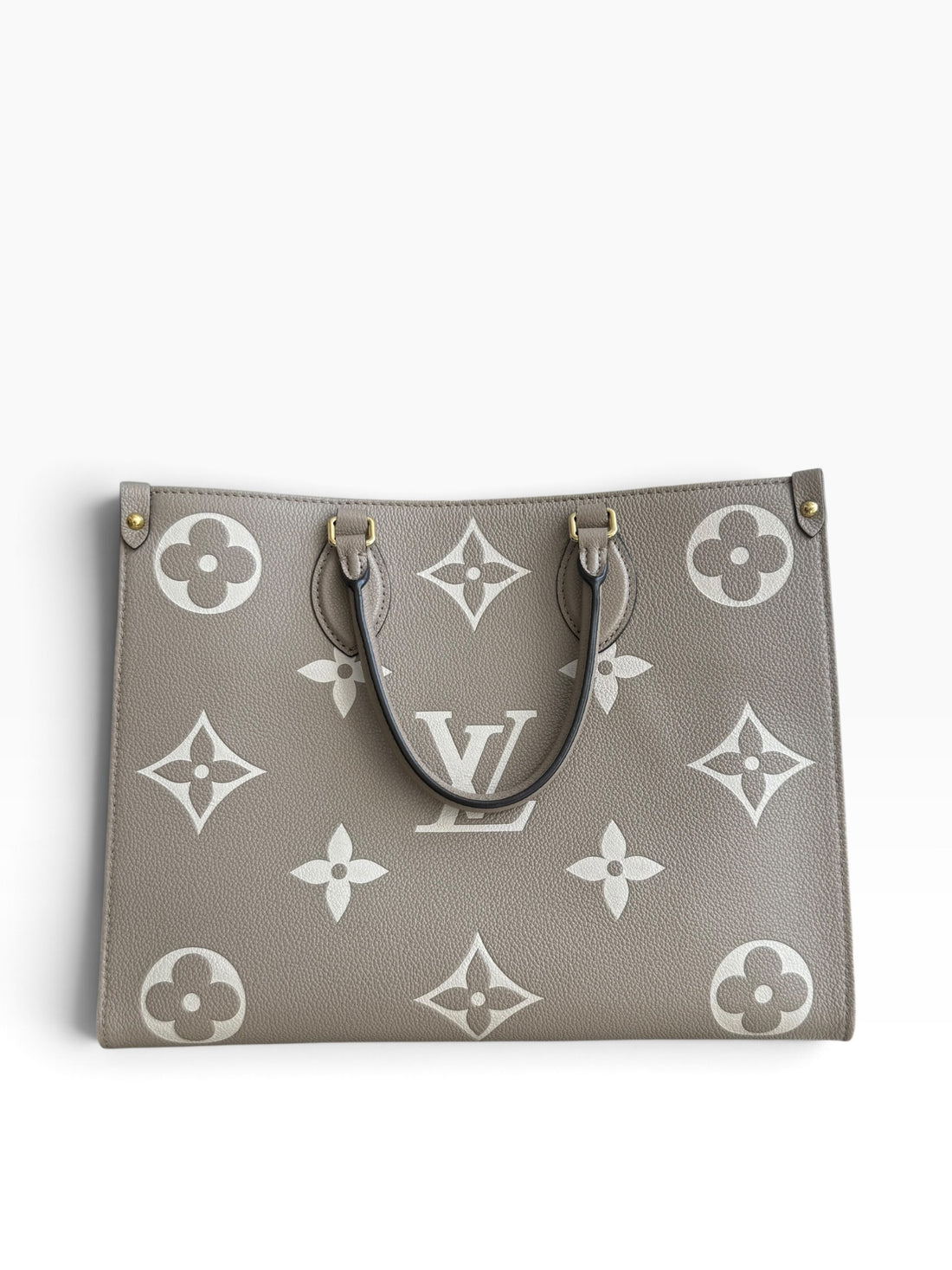 Louis Vuitton On-The-Go MM in Empreinte Leder in der Farbe Tourterelle / Beige Beige.