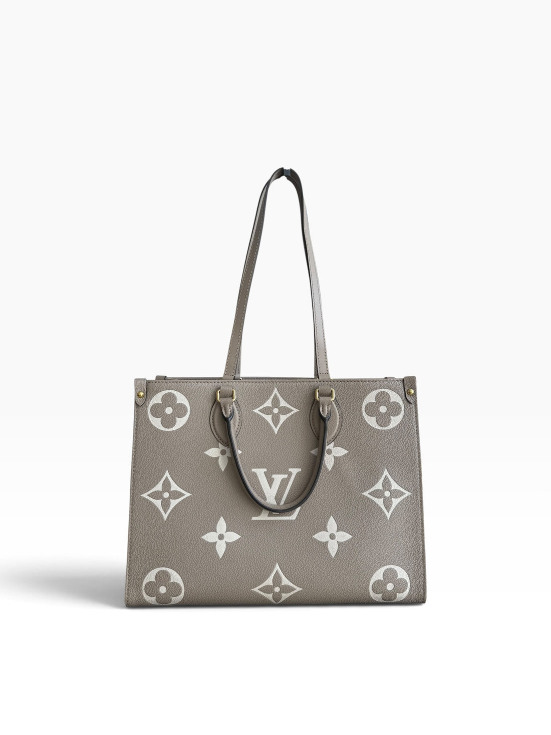 Louis Vuitton On-The-Go MM in Empreinte Leder in der Farbe Tourterelle / Beige Beige.