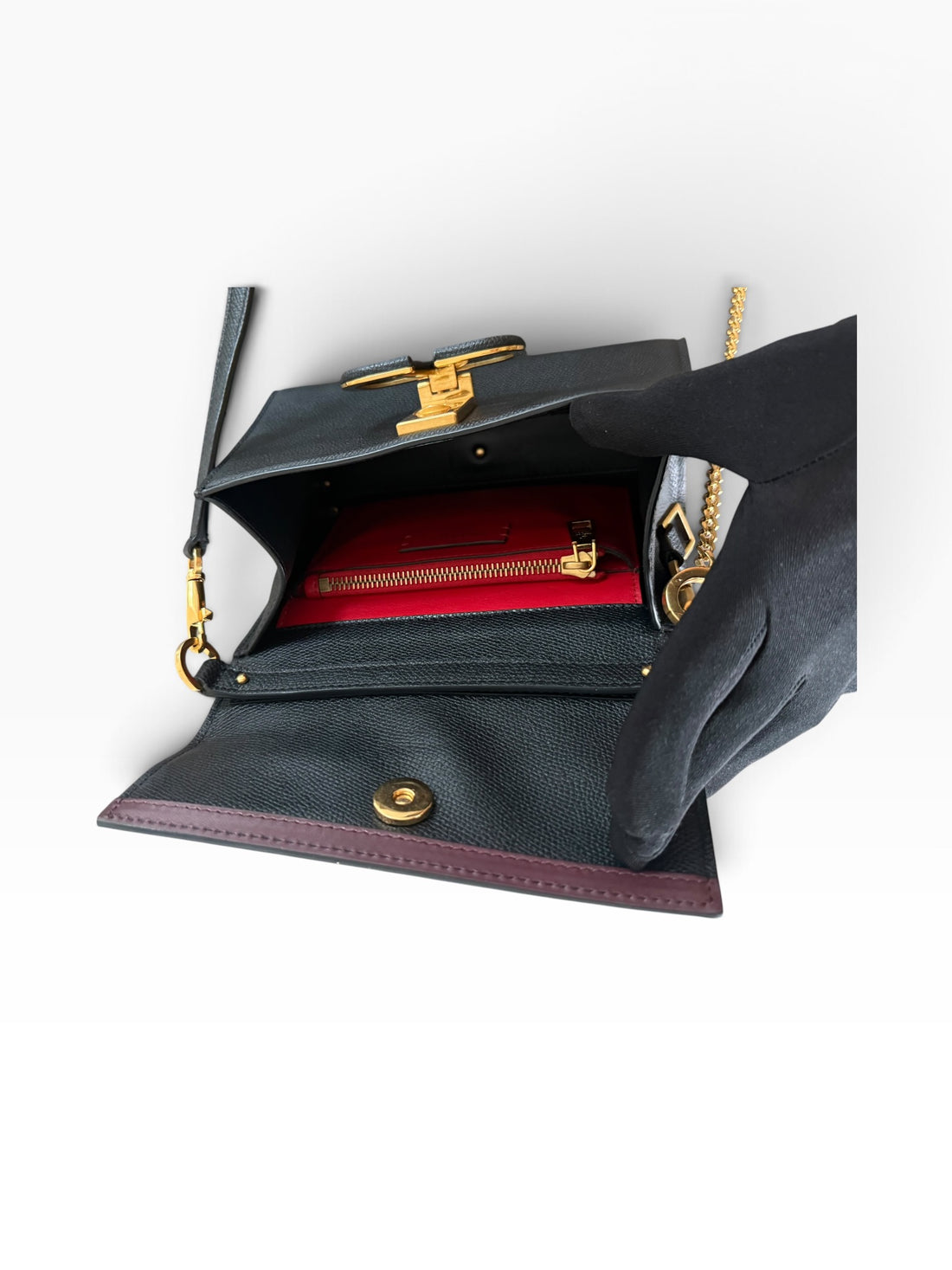 Petit sac à main Valentino Garavani Vsling en cuir de veau grainé noir.