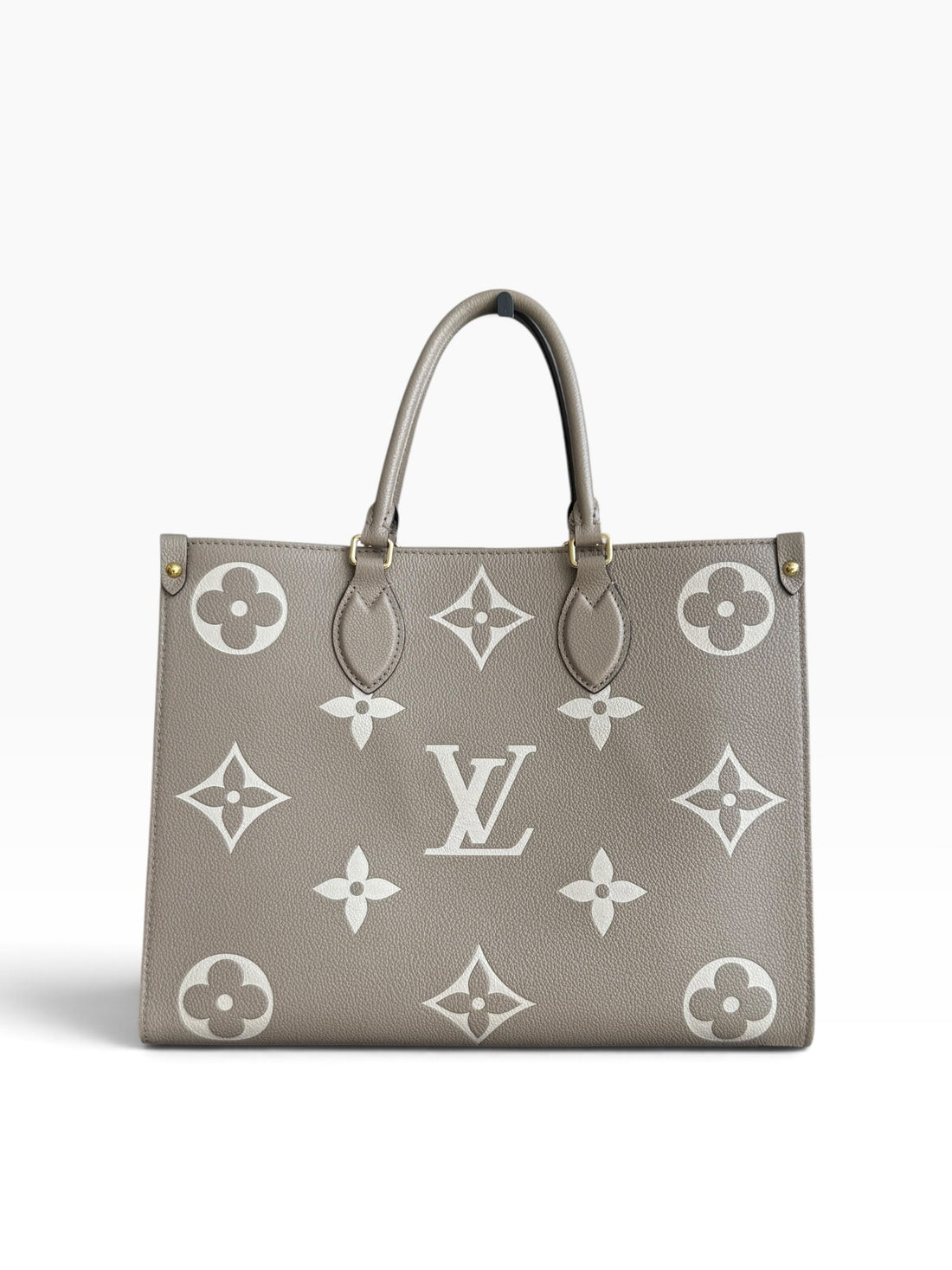 Louis Vuitton On-The-Go MM in Empreinte Leder in der Farbe Tourterelle / Beige Beige.